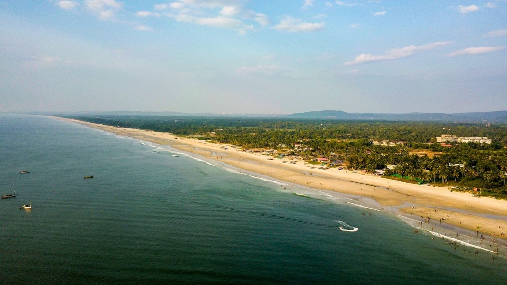 Wide sandy beach of Colva and Benaulim in South Goa with water activities